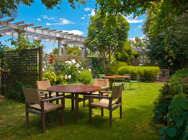 Dining table set in lush garden