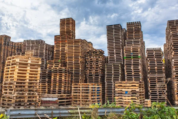 Stacks of Wooden Transportation Pallets