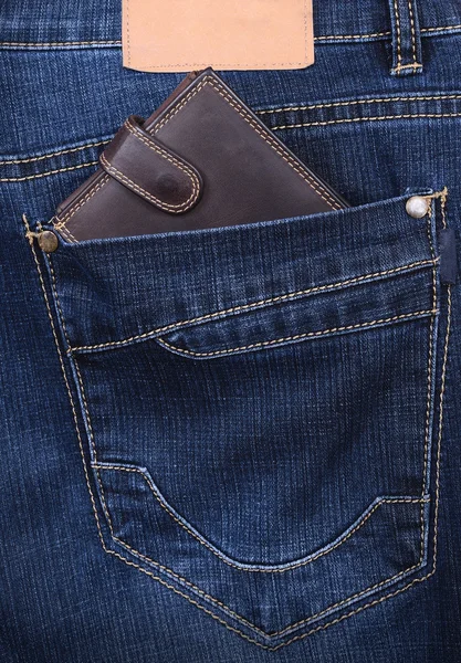 Brown wallet in the jeans pocket