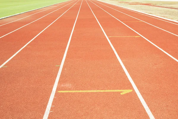 Running track with white line texture.