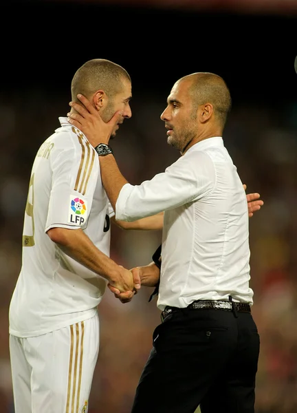 Karim Benzema of R Madrid and FC Barcelona coach Guardiola
