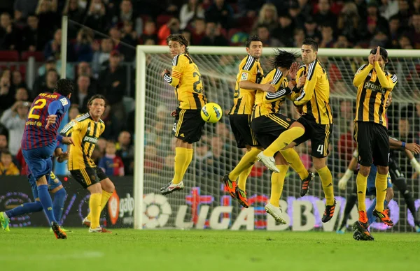 Dani Alves of FC Barcelona shoots free kick