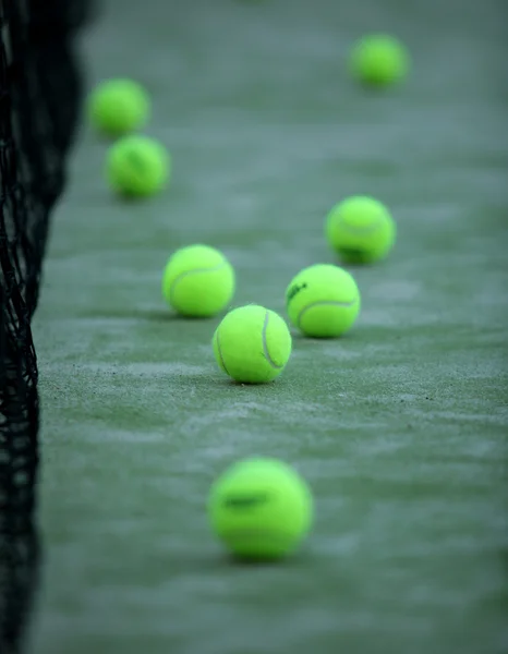 Tennis or paddle balls on synthetic grass