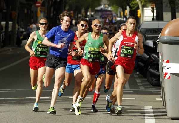 Barcelona street crowded of athletes running