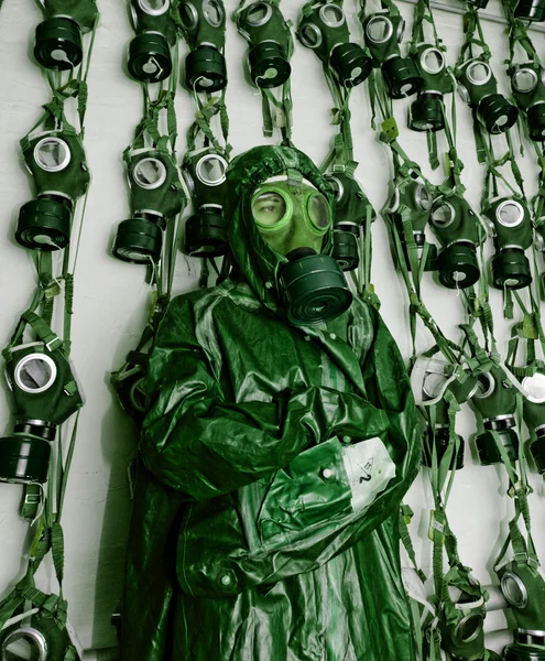 Old military gas on a chemical protective suit woman green