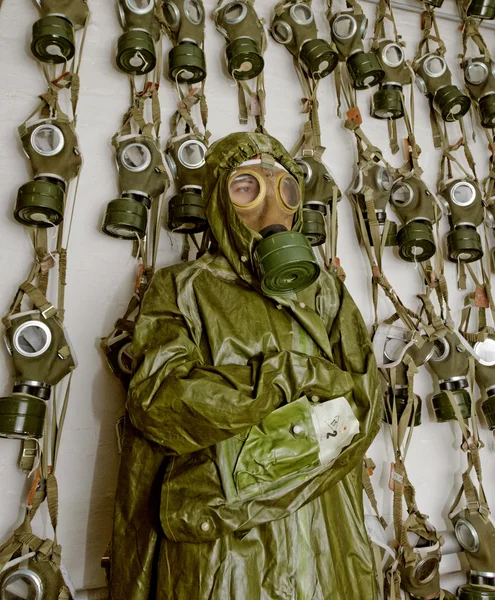 Old military gas on a chemical protective suit woman
