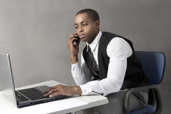 Young Black man working on his Laptop