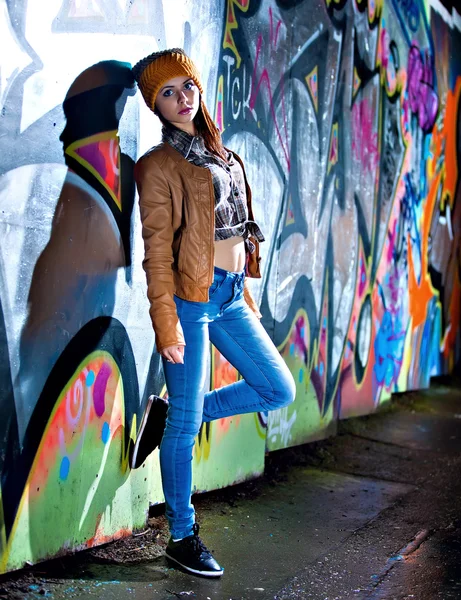 Pretty young girl and graffiti