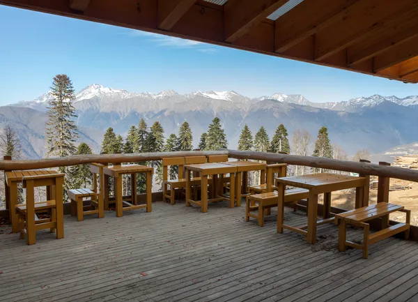 Cafe with a view of the mountains against the blue sky