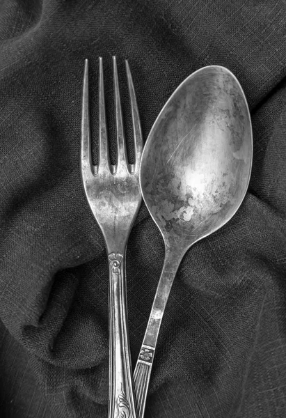 Vintage silver spoon and fork on linen napkin — Stock Photo #37160197