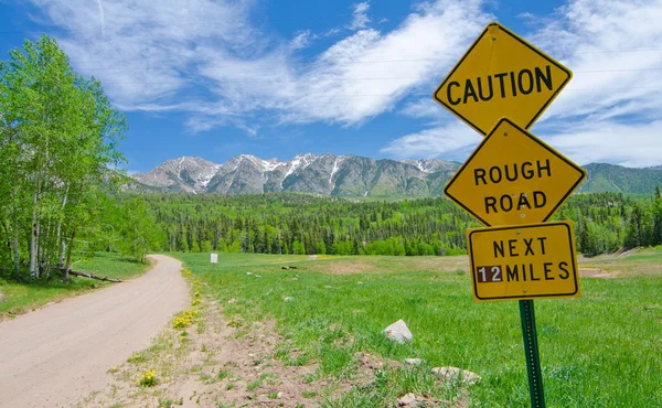 Caution: Rough Road Sign in the San Juan Mountains in Colorado