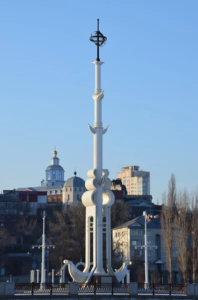 VORONEZH - FEBR. 23: Monument to young Russian military fleet on Admiralty Square in Voronezh on February 23, 2013. White monument and street lanterns stylized as ship mast against the city buildings.