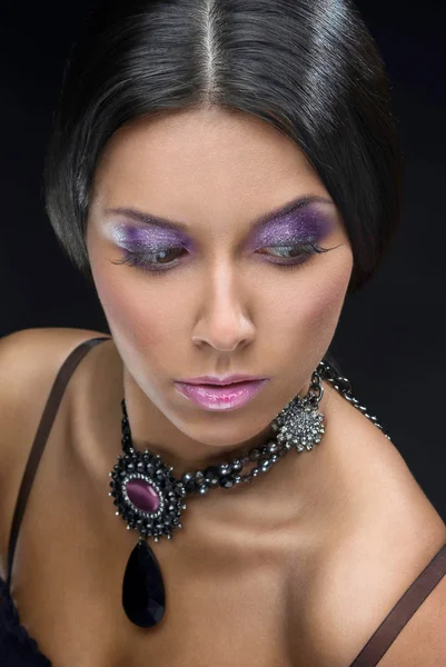 Beautiful woman with evening make-up. Jewelry and Beauty. Fashion art photo