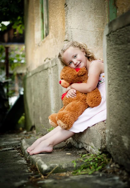 Girl with her teddy