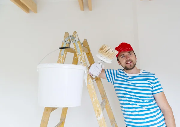 Man painting the walls