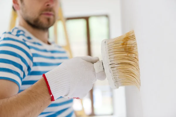 Man painting the walls