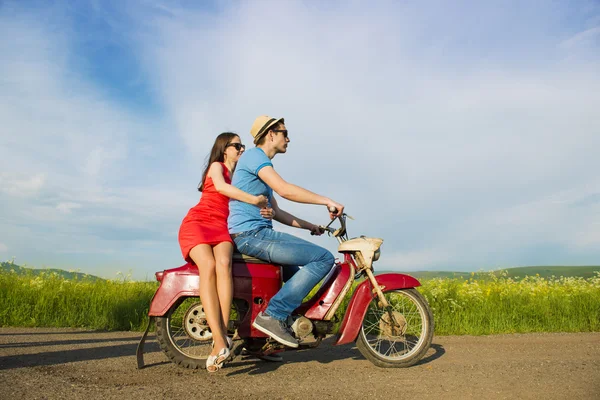 Couple on retro motorbike