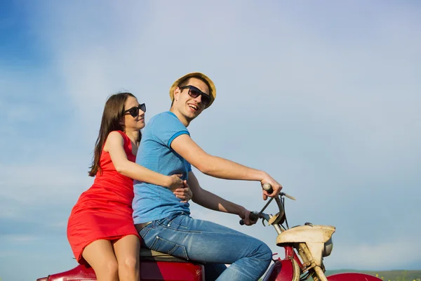 Couple on retro motorbike