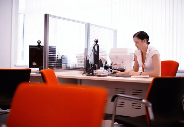 Girl works at the computer manager