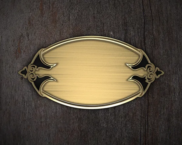 Gold nameplate on a wooden background