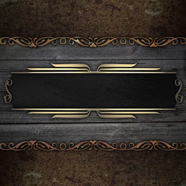 Wooden background with rust metal plate and black nameplate