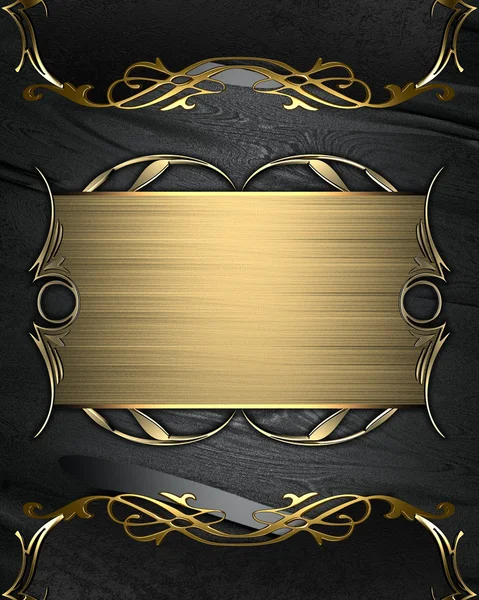 Black texture with the gold plate with a beautiful gold ornament
