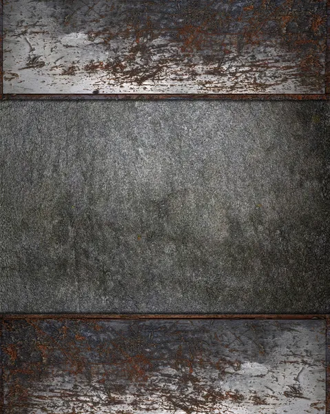 Background of stone with a rusty plate for writing on edges