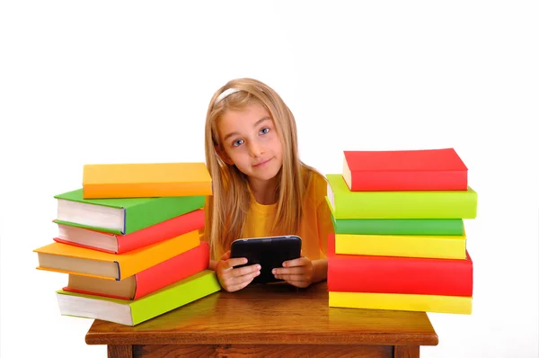 Beautiful girl reading e-book surrounded by books, isolated on white