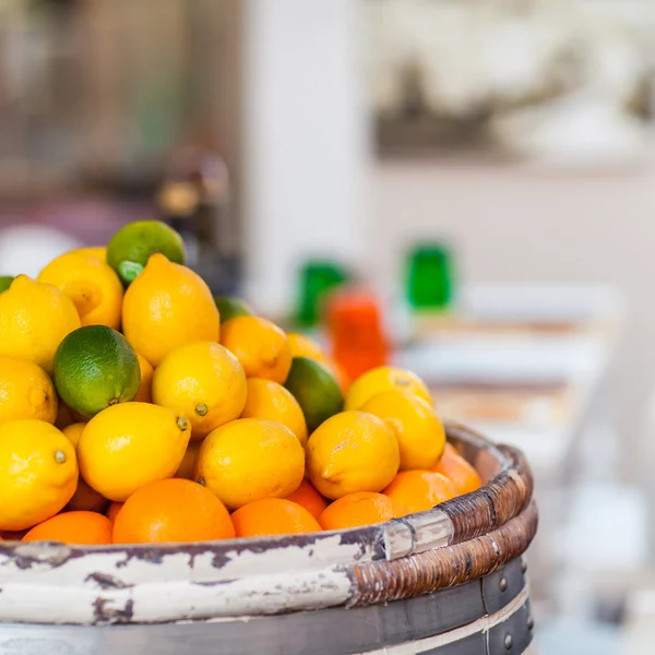 Barrel of Fresh Lemons, imes and Oranges on Street Market