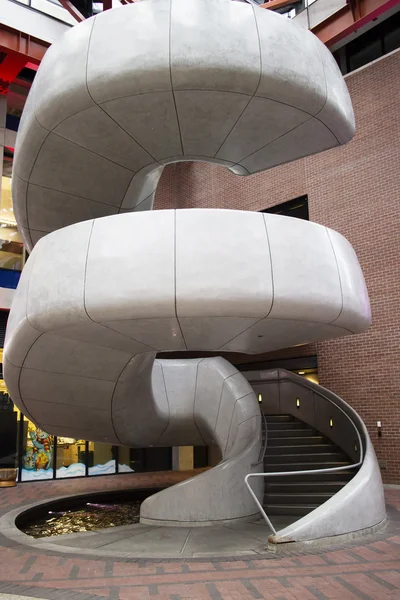 Marble spiral staircase in urban shopping plaza