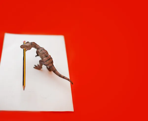 Dinosaur and pencil
