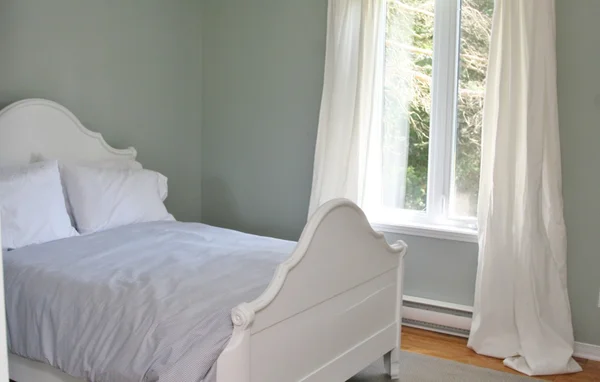 Bedroom with bed and curtains