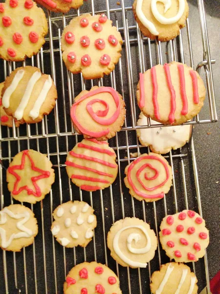 Decorated cookies on cooling rack