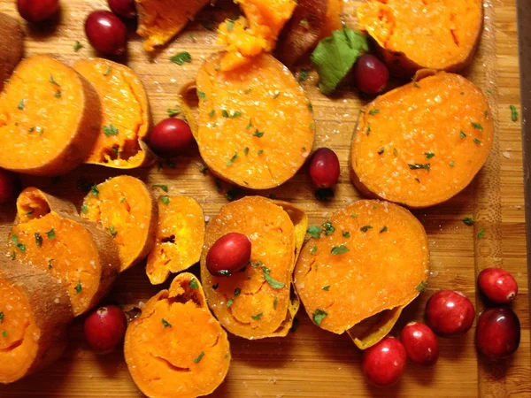 Baked sweet potato with cranberries, for Thanksgiving and New Year table, holiday food, family food