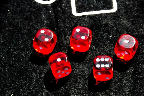 Closeup of red dices to play casino or gambling money