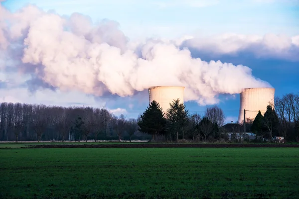 A nuclear power plant located in the countryside close to homes
