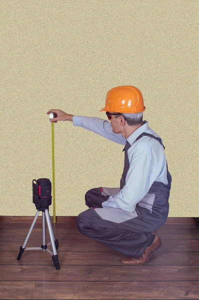 Foreman checks the quality of a laser level
