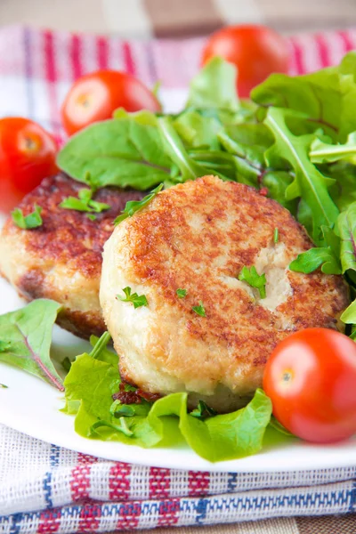 Chicken cutlets with salad greens