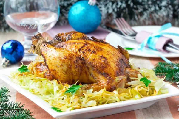 Roasted whole chicken with golden crust and garnish of stewed ca
