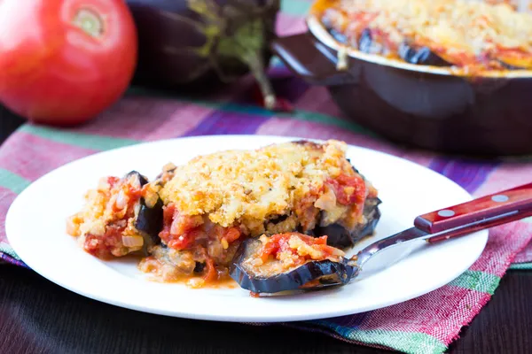 Tasty Italian dish, appetizer with eggplant, cheese and tomato s