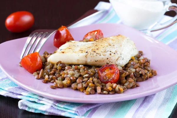 White fish fillet of perch, cod with vegetables and lentils, tom