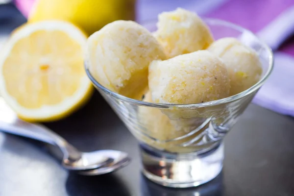 Lemon ice cream sorbet, balls in glass, refreshing summer diet d