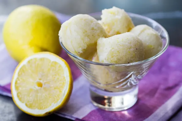 Lemon ice cream sorbet, balls in glass, refreshing summer diet d