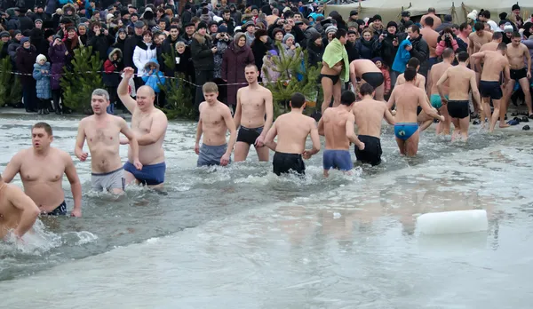 People bathe in the river in winter . Christian religious festival Epiphany