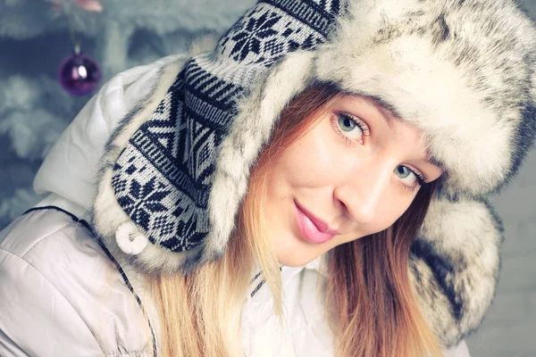 Beautiful young girl in winter clothes