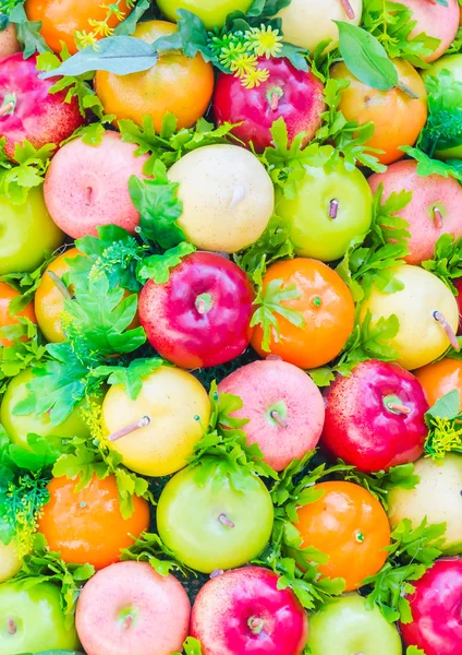 Plastic fruits background