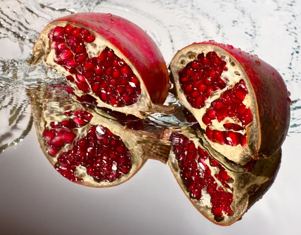 Two slices of ruby pomegranate