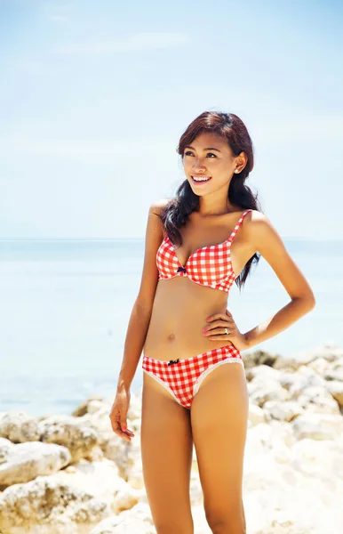 Beautiful asian woman in bikini at sea — Stock Photo #19922087