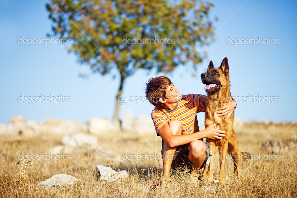 http://st.depositphotos.com/1888161/1992/i/950/depositphotos_19922571-stock-photo-boy-with-a-dog-in.jpg