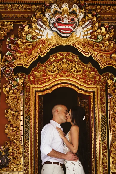Couple on exotic wedding in hindu temple, bali, indonesia